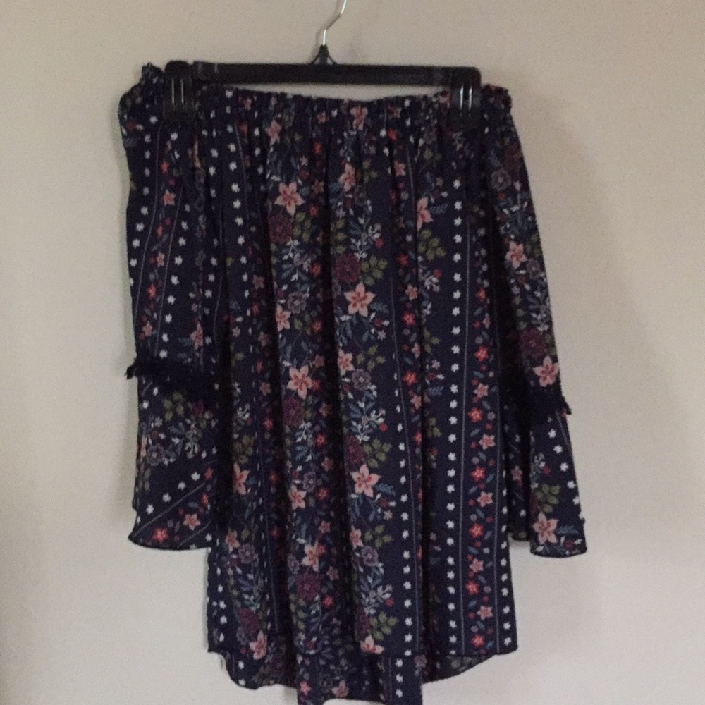 Sweet, off the shoulder top with bell sleeves.